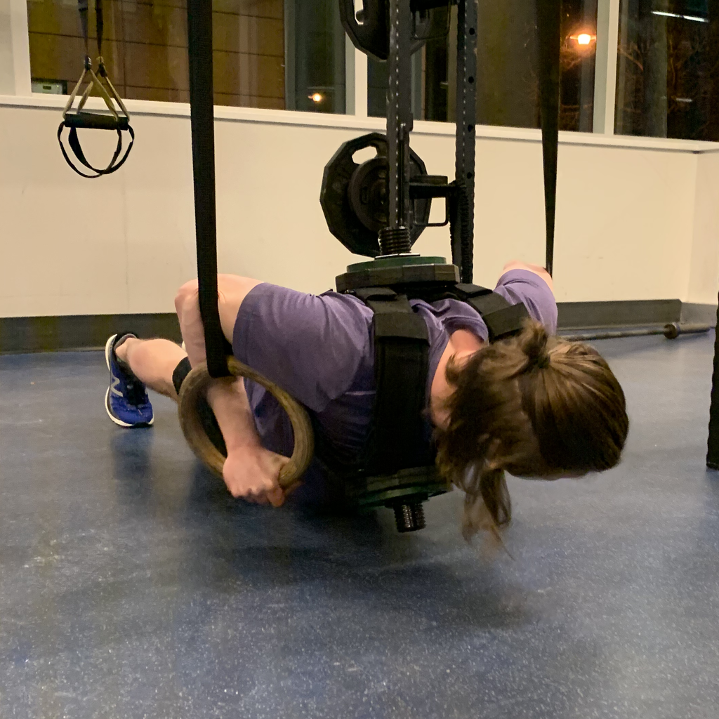 Inverted ring hold performed while wearing a loaded vest